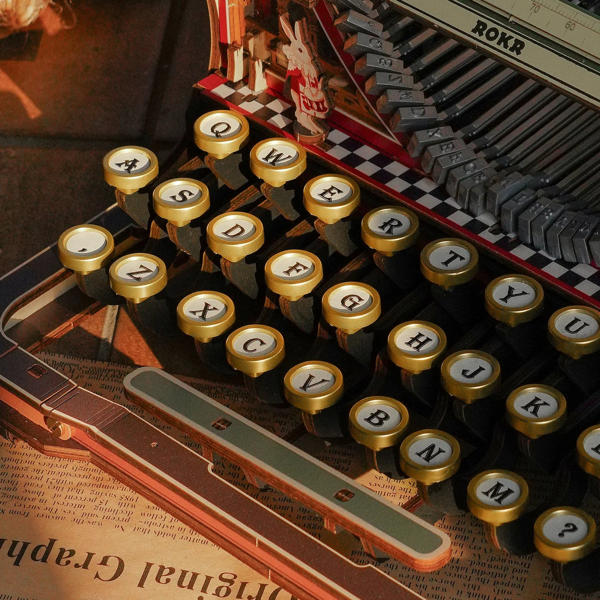 Close-up of the round gold-rimmed keys and space bar — LK703Ce